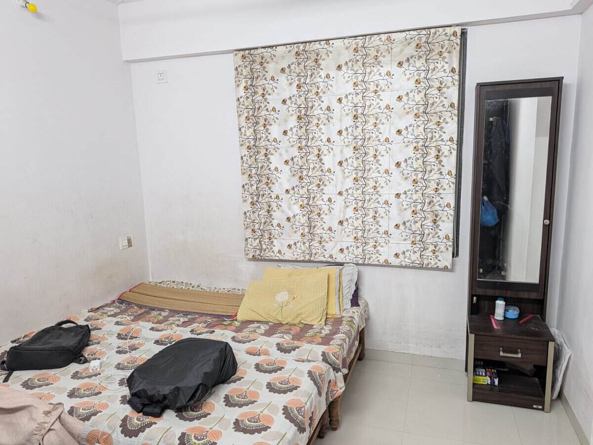 Second bedroom with full size wardrobe and dresser in Estella Wakad rental apartment