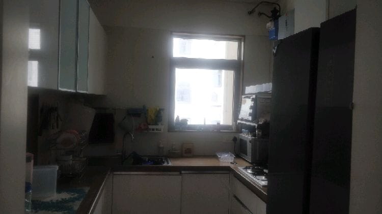 Ventilated modular kitchen with window, hob and chimney at EON Homes Hinjewadi Phase 3