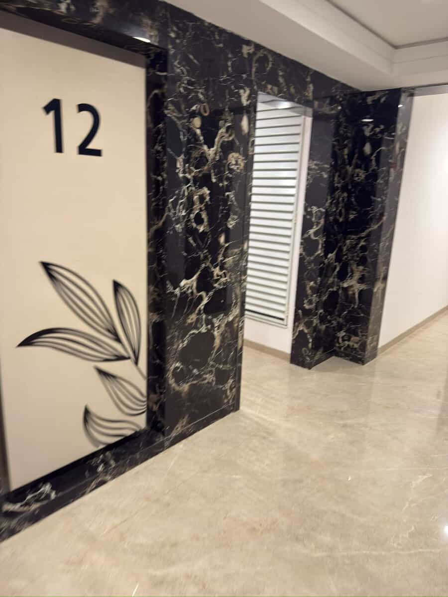 12th floor elevator lobby with marble cladding at Majestique Signature Balewadi – flat on rent near Baner