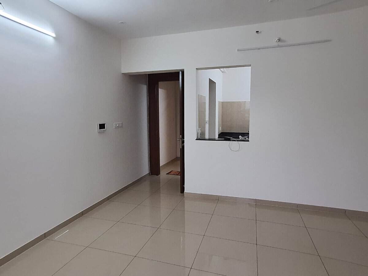 Living room with video door phone and dry kitchen window in 2 BHK rental Yashone Hinjewadi Phase 1 Pune