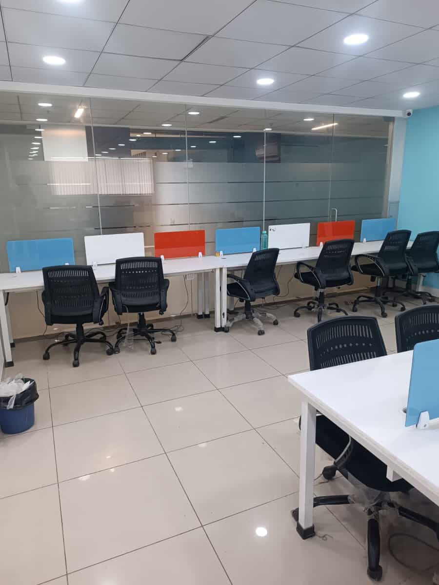 Workstation row beside glass-partitioned meeting area on the 7th floor office at Suratwala Mark Plazzo Hinjewadi Pune