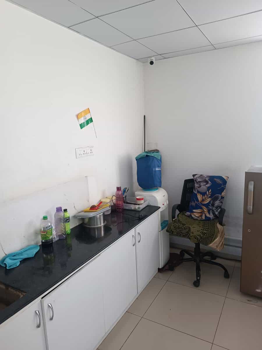 Office pantry with granite counter and storage units in the furnished Suratwala Mark Plazzo Hinjewadi office space for rent