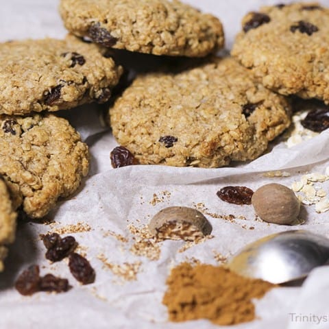 Spicy nutmed cookies, made with gluten-free oats, cinnamon & raisins. Vegan recipe from Trinity Bourne