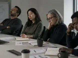 A leadership team in discussion around a table — illustrating why recurring business problems persist without a structured process.