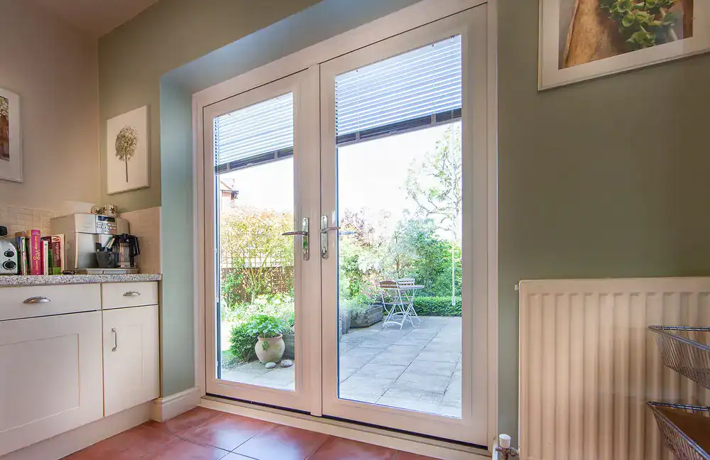 white framed french door