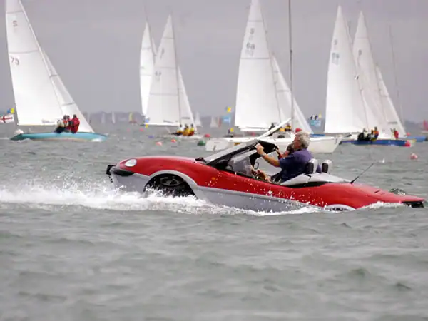 A car sailing at Cowes week.