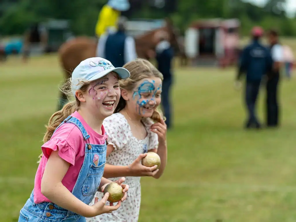 Kids competing for prizes at the stonehenge polo festival near salisbury in wiltshire