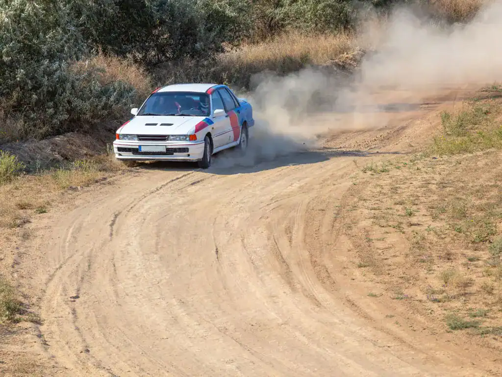 rally driving in dirt track