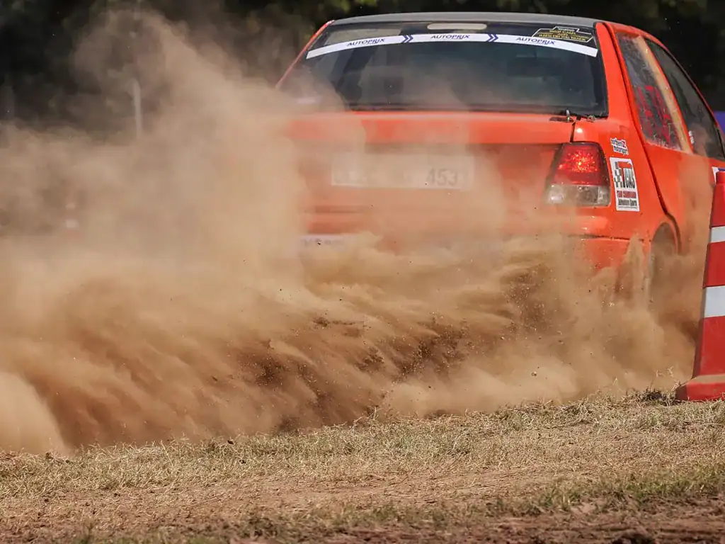 rally driving in dirt track