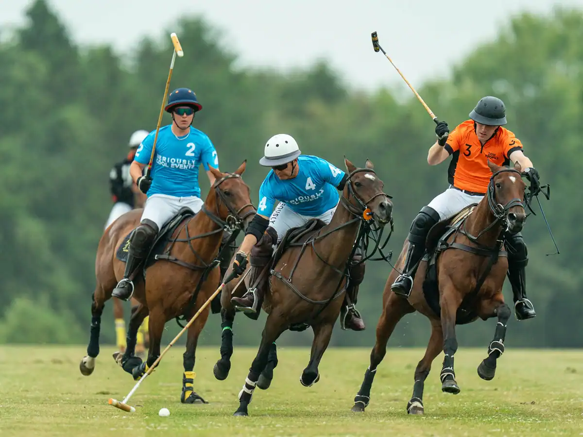 Seriously Cool Events polo team on the ball at the Stonehenge Polo Festival