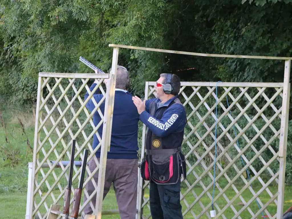 client getting instruction at a clay shooting event&nbsp;