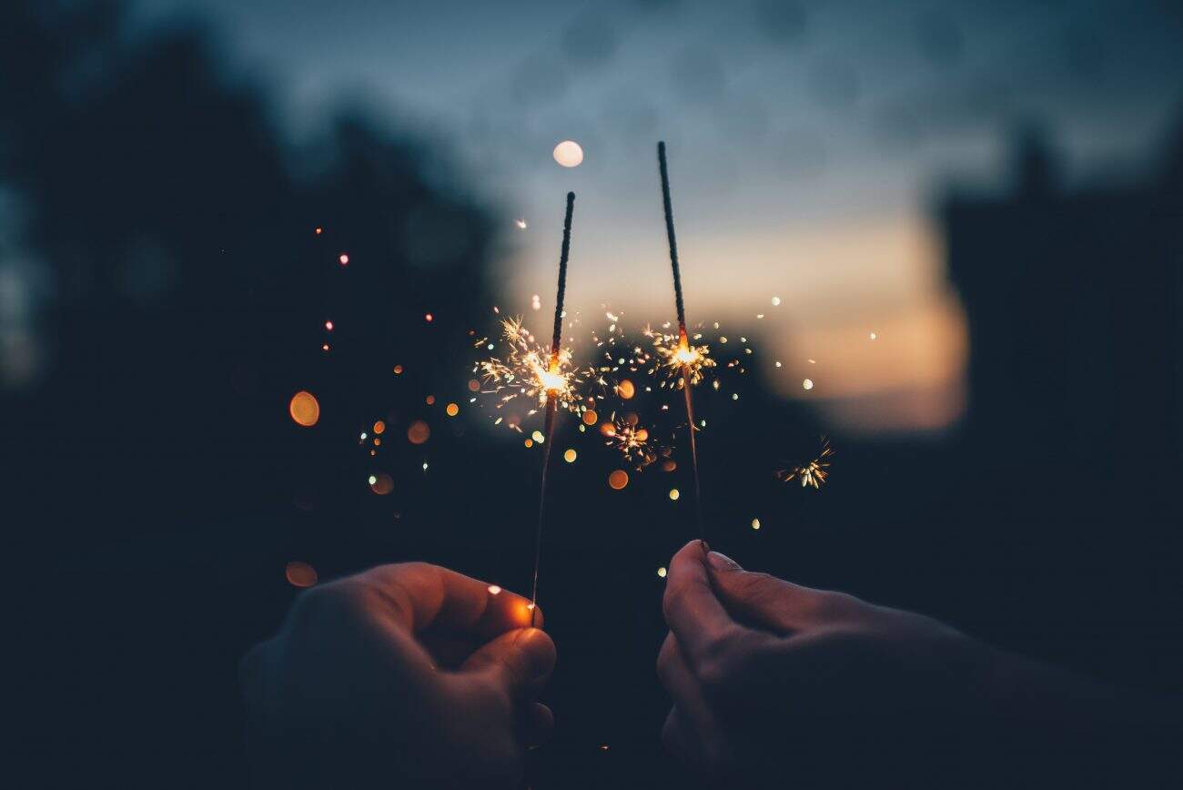 sparklers at night in hands