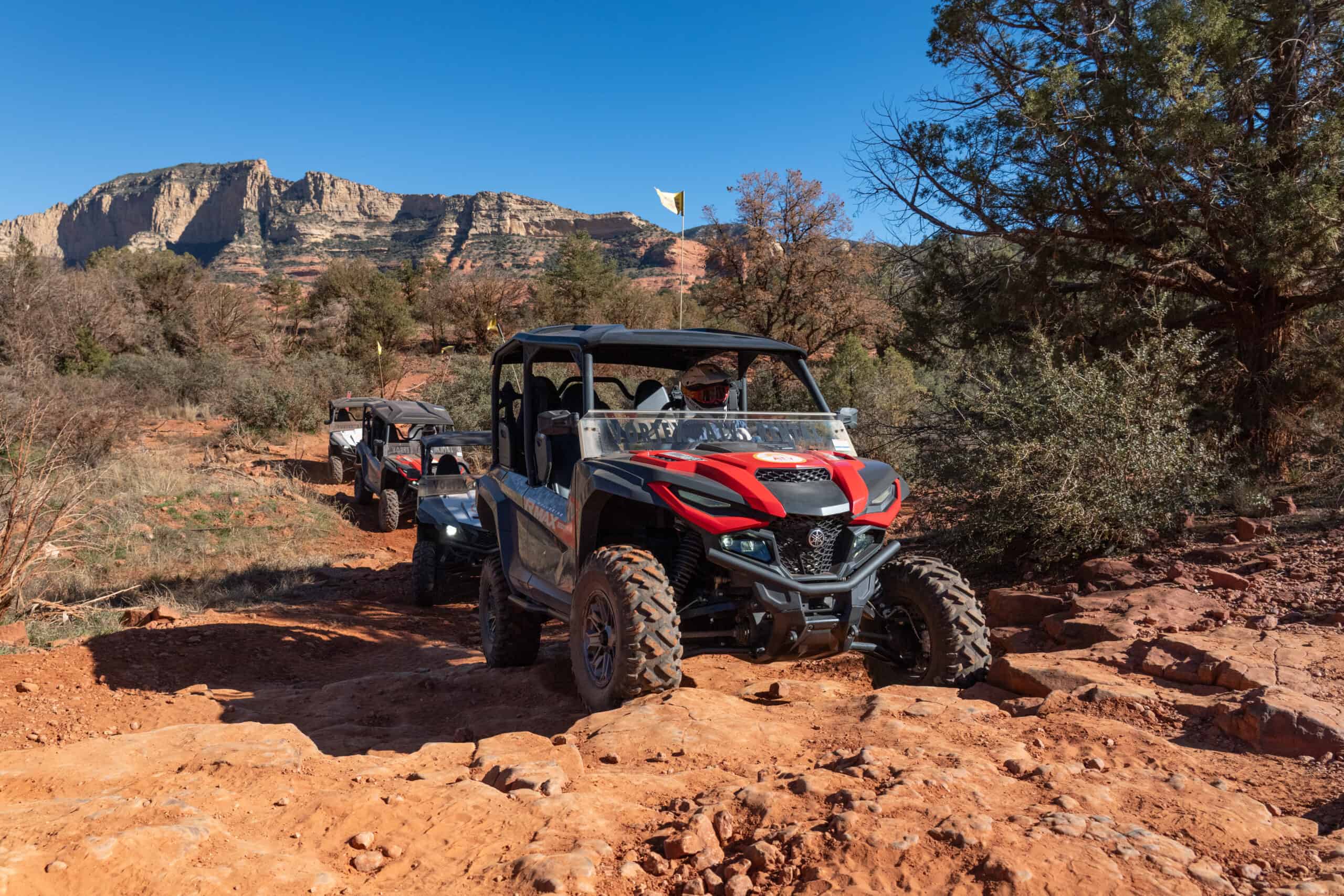 Fleet off-roading through the rough red rock terrain