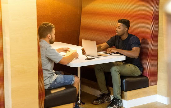 Two people sat at a table